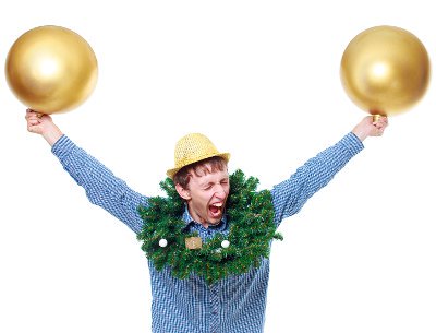 Goofy guy wearing party hat with Christmas wreath around his neck as he holds up two golden balloons at a Christmas party